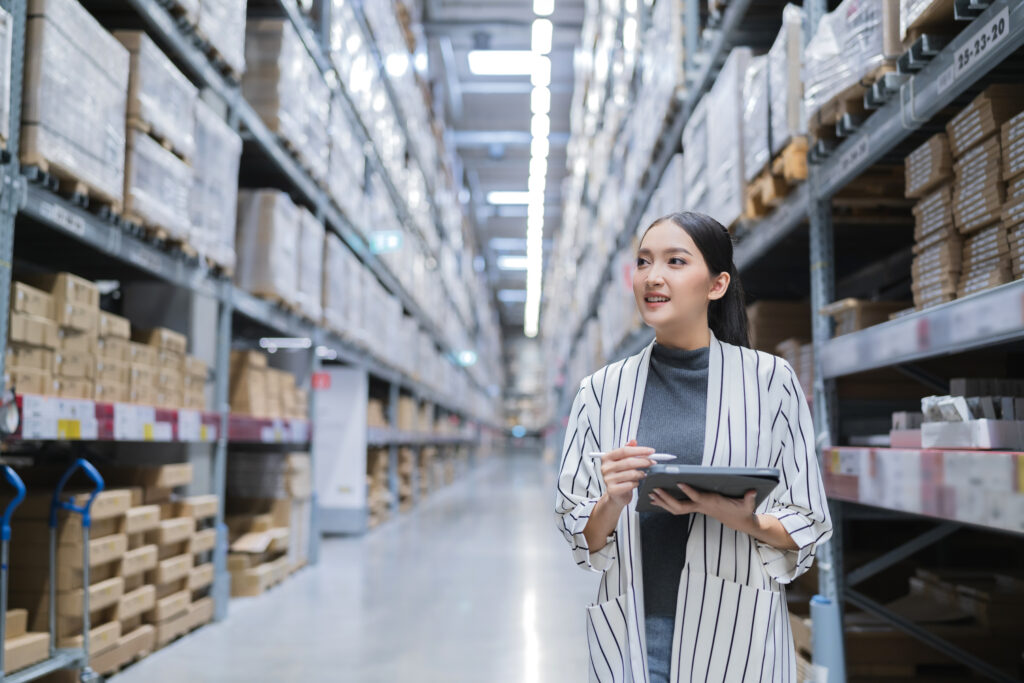 Woman at fulfillment center checking stock